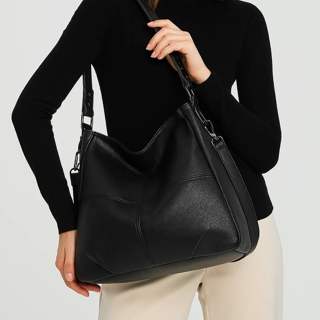 Woman carrying the Atis genuine leather bag